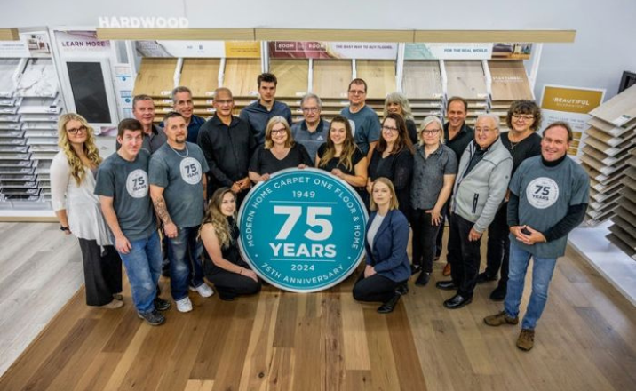 Modern Home Carpet One flooring store in Bracebridge, ON, team celebrating 75 years running.
